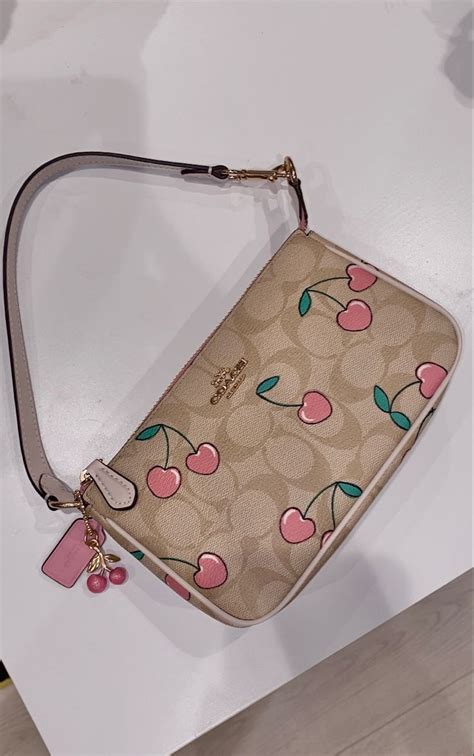 coach handbags with symbol on